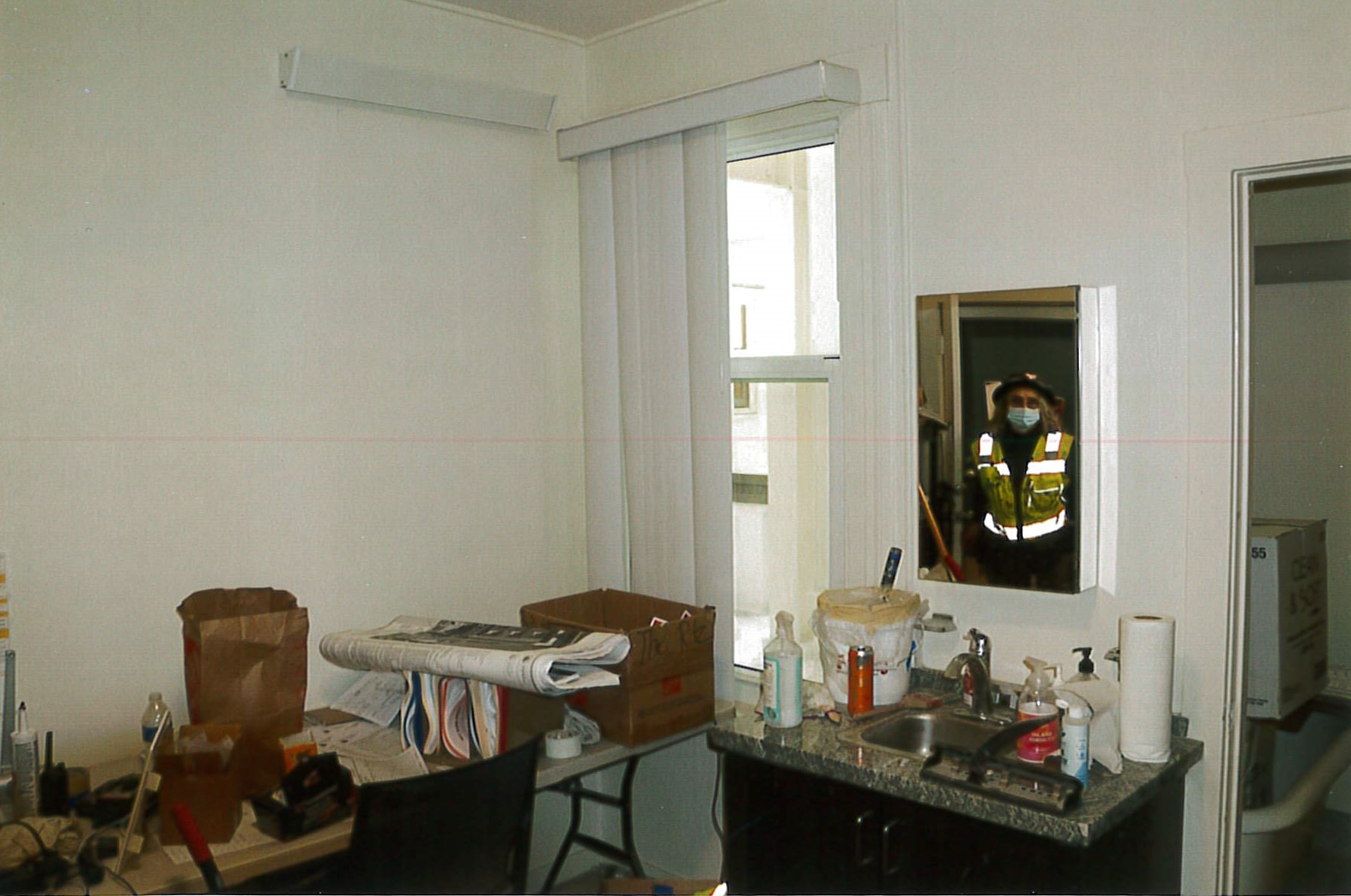 Still under construction residential unit with new vanity, window treatments